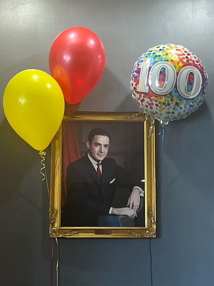 portrait of Dr. Mervin with balloons